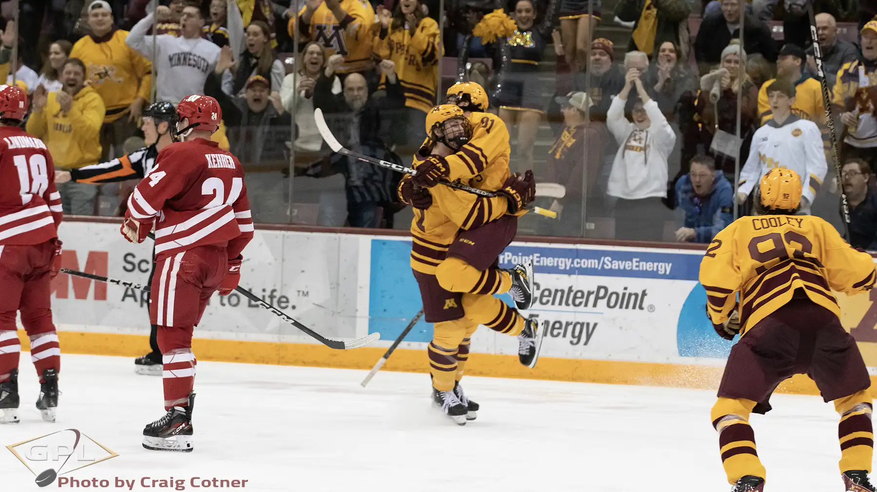 Ryan Chesley celebrates his first goal as a Gopher with Jimmy Snuggerud