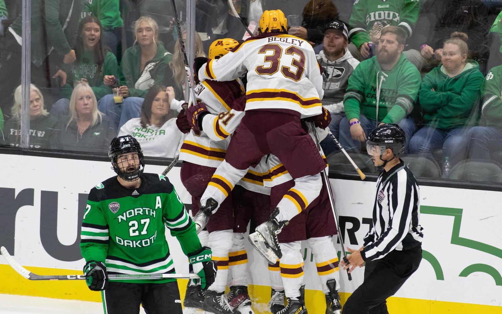 The team celebrates Oliver Moore's first goal in the Maroon & Gold