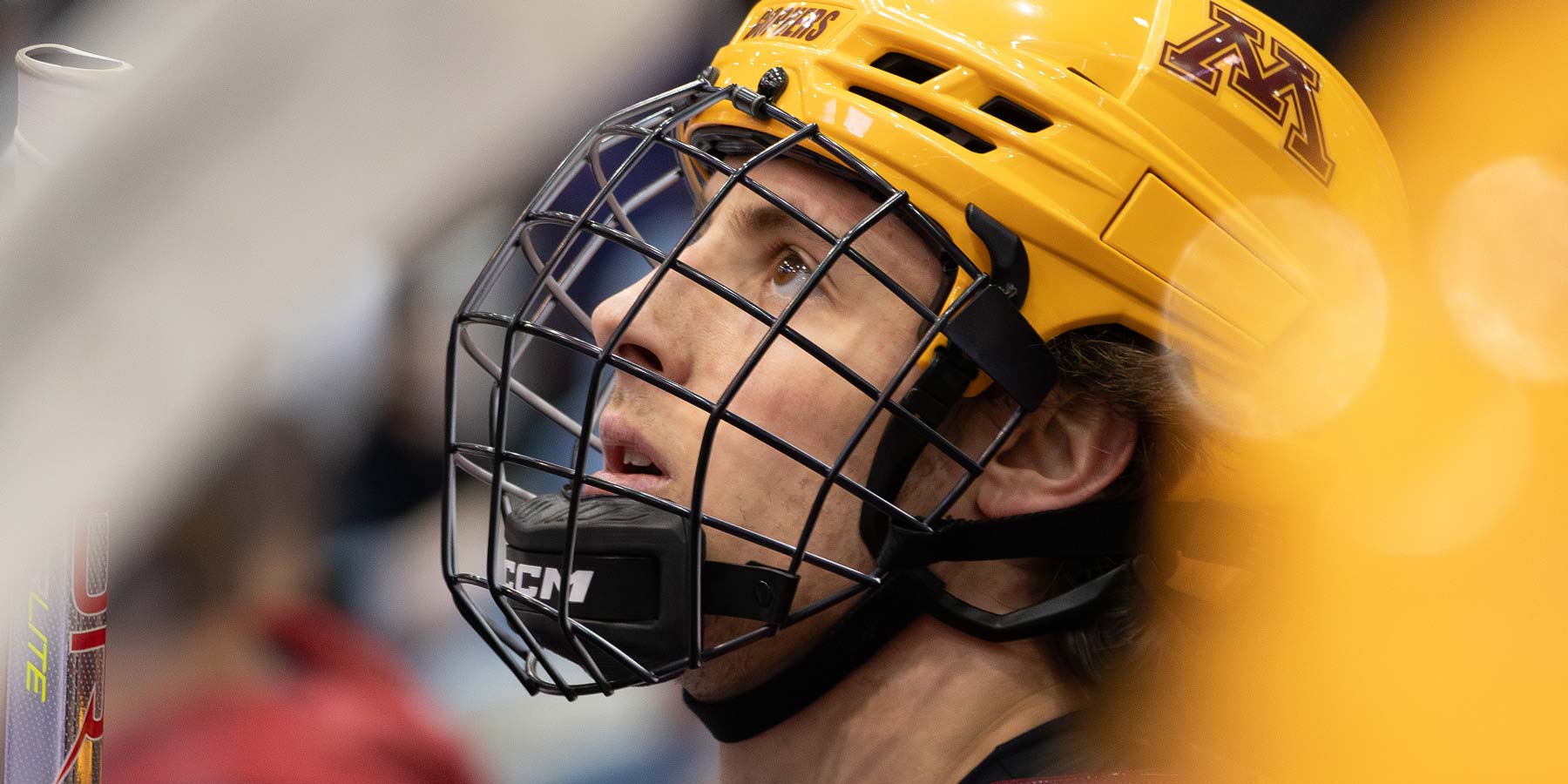 Rhett Pitlick looking up at the scoreboard from the Minnesota bench.