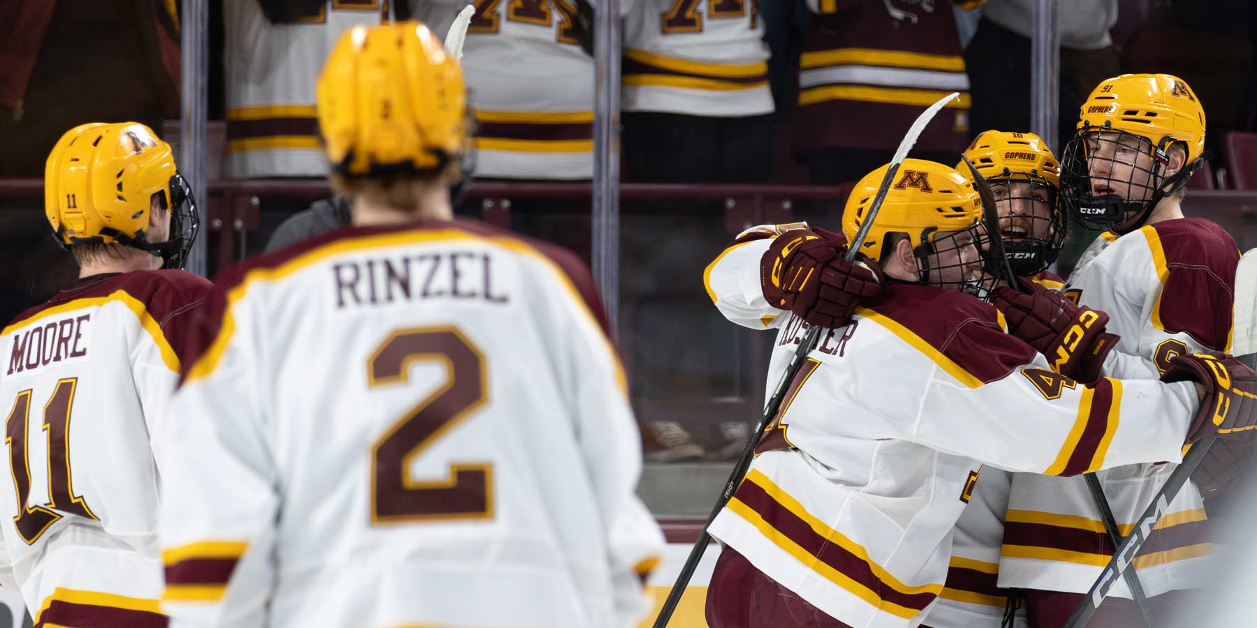 Connor Kurth celebrating with Koster and Wood. Photo by Craig Cotner.