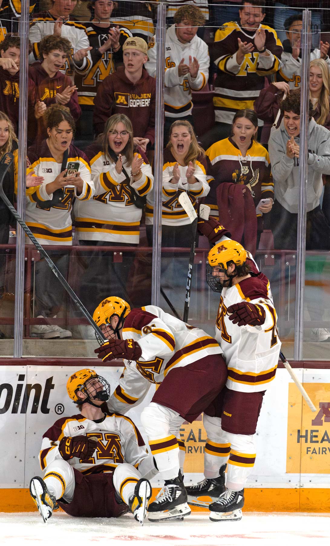 Sam Rinzel on the ice celebrating. Photo by Craig Cotner.