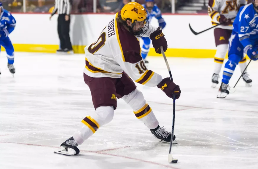 Connor Kurth Shooting the puck.