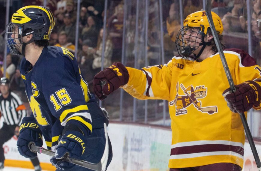 Connor Kurth pushes Jacob Truscott away after scoring Minnesota's 6th goal. Photo by Craig Cotner.