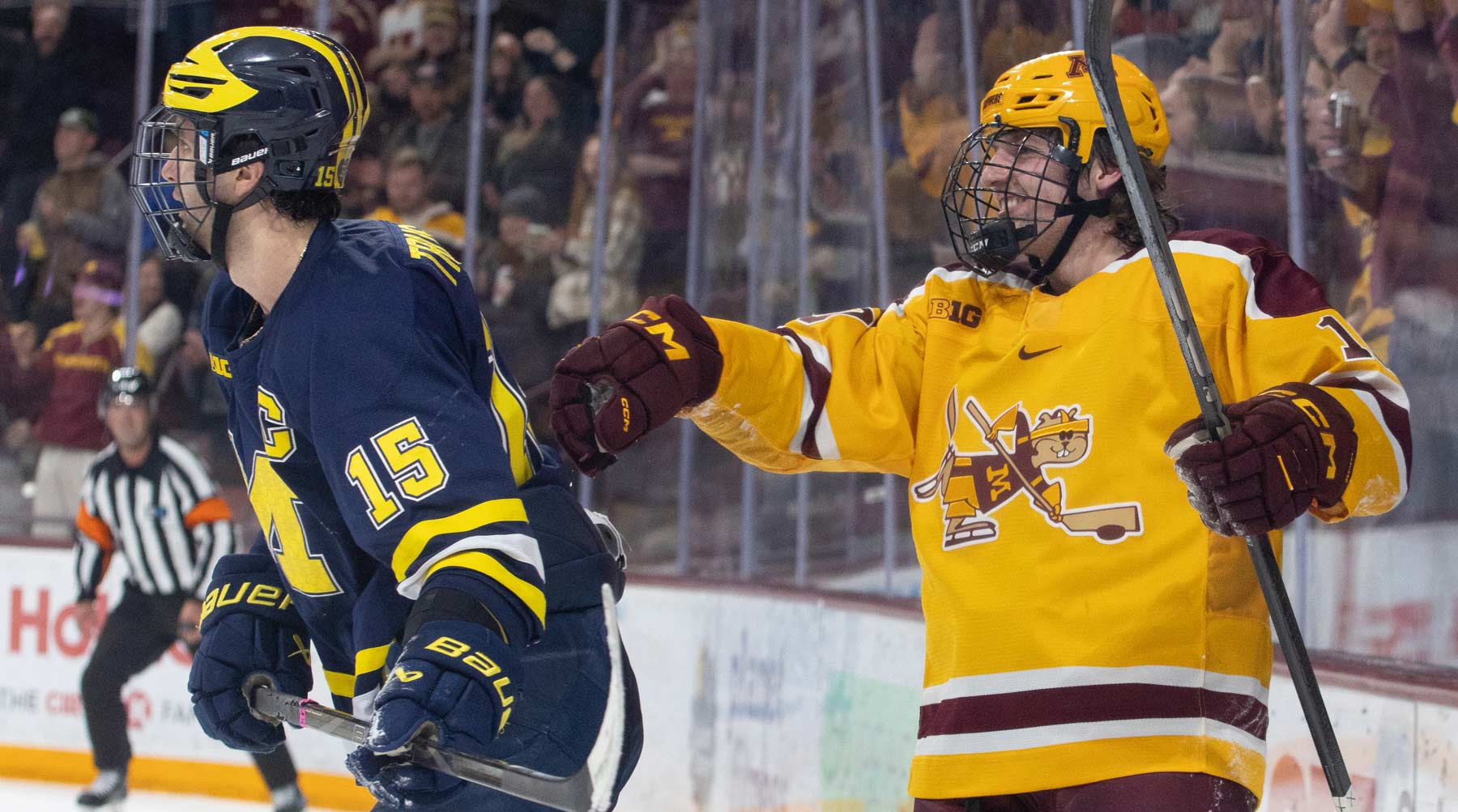 Connor Kurth pushes Jacob Truscott away after scoring Minnesota's 6th goal. Photo by Craig Cotner.