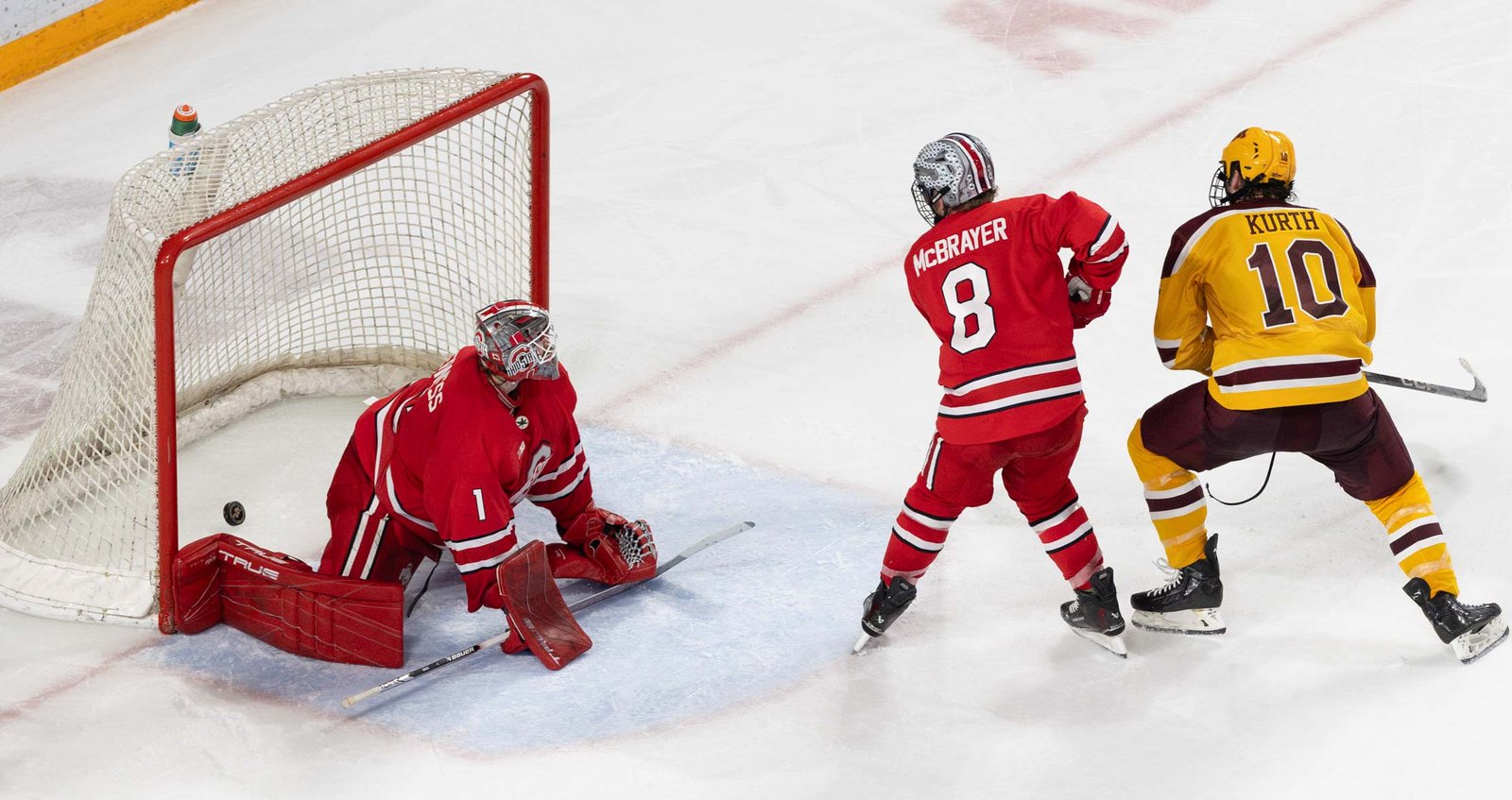 Connor Kurth spins and scores Minnesota's 4th goal.