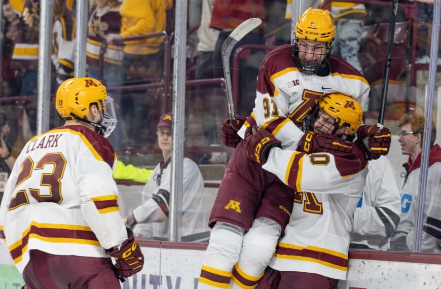 Matthew Wood leaps in to Connor Kurth arms after a goal. Photo by Craig Cotner.