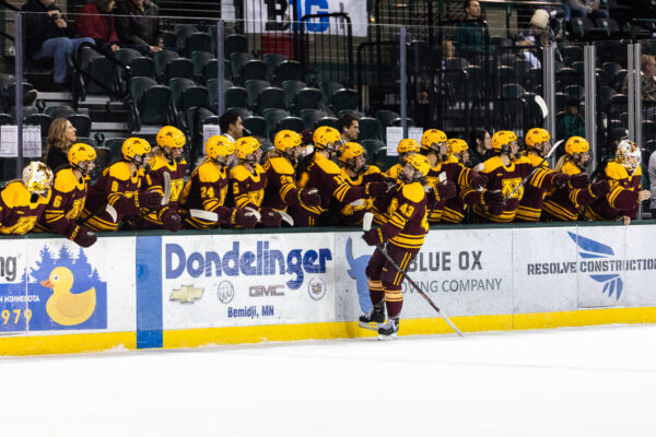 Gopher Forward Adrianna Milani celebrates her first period goal on on Friday Night. Photo by: Brent Cizek.